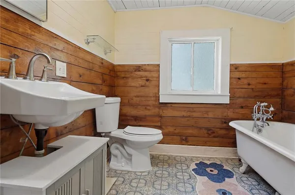 a bathroom with a bathtub and a sink