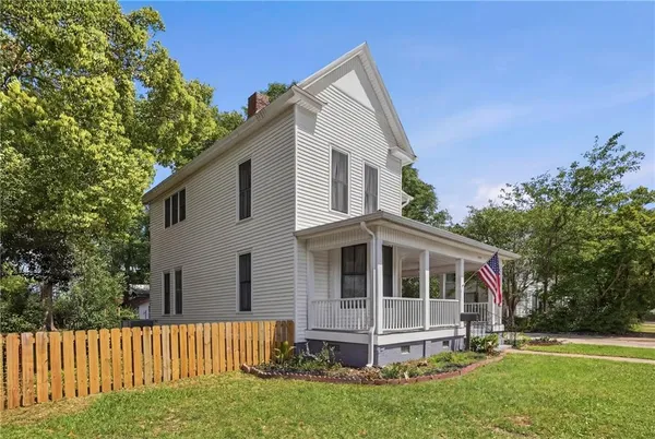 a living room with furniture and windows