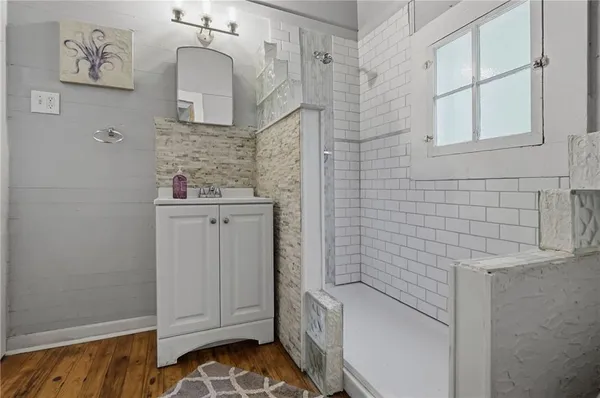a bathroom with a toilet and shower