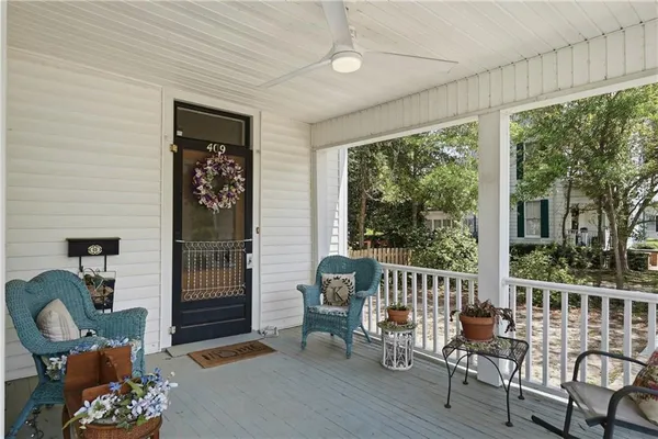 a front view of a house with outdoor seating