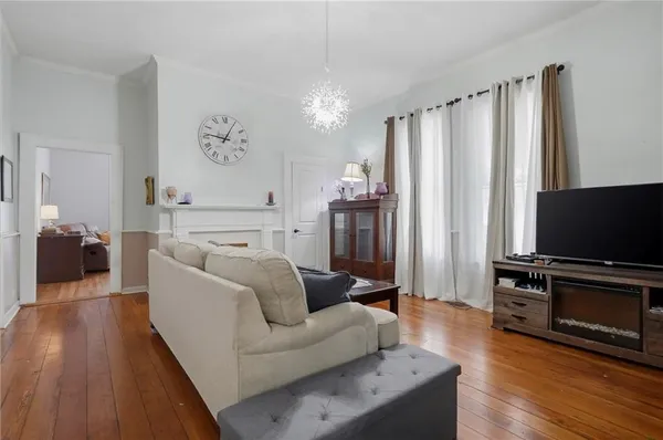 a living room with furniture a fireplace and a table