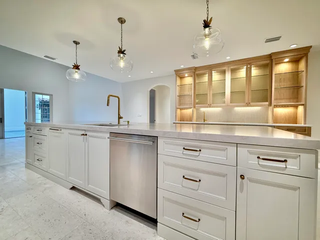 a bathroom with a granite countertop sink mirror and a