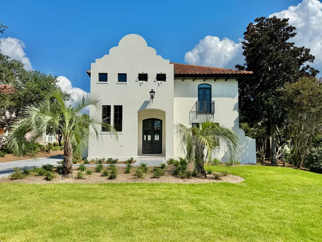 a dining room with furniture a chandelier and window