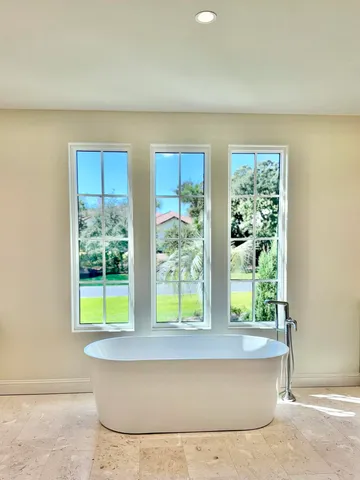 a bathroom with a mirror and a sink