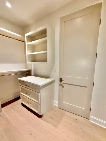 a view of a house with brick walls