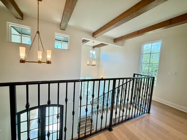 a view of a white house with a yard