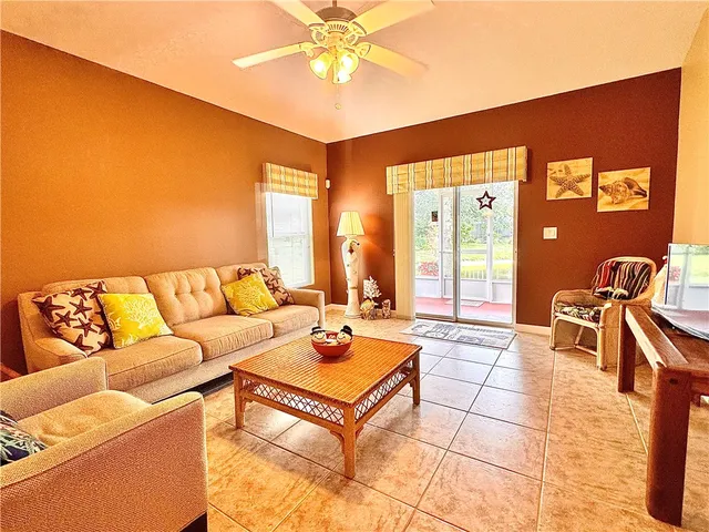 a view of a livingroom with furniture and a flat screen tv