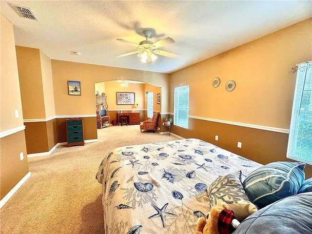 a view of a livingroom with workspace and a couch