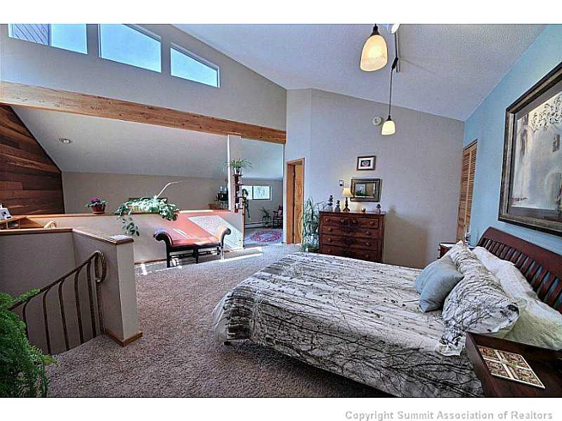 9460 Ryan Gulch Road, Unit 485 Silverthorne, CO 80498 - Photo 20 of 23 Master Bedroom.