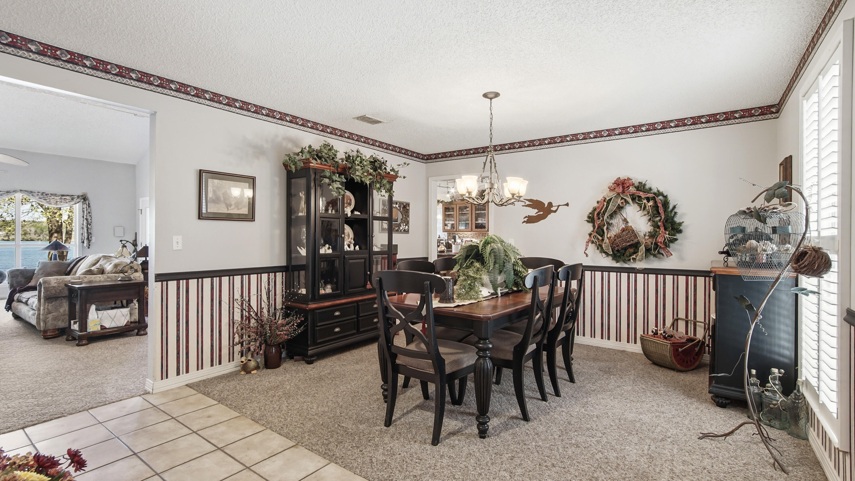 2272 Spring Lake Road DeFuniak Springs, FL 32433 - Photo 13 of 48 a view of a dining room with furniture window and wooden floor