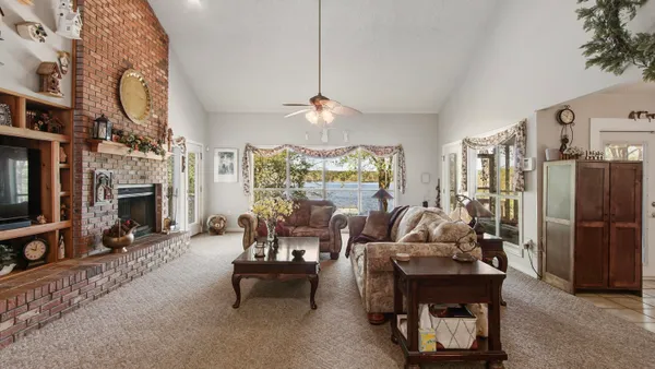 a dining room filled with furniture and a chandelier