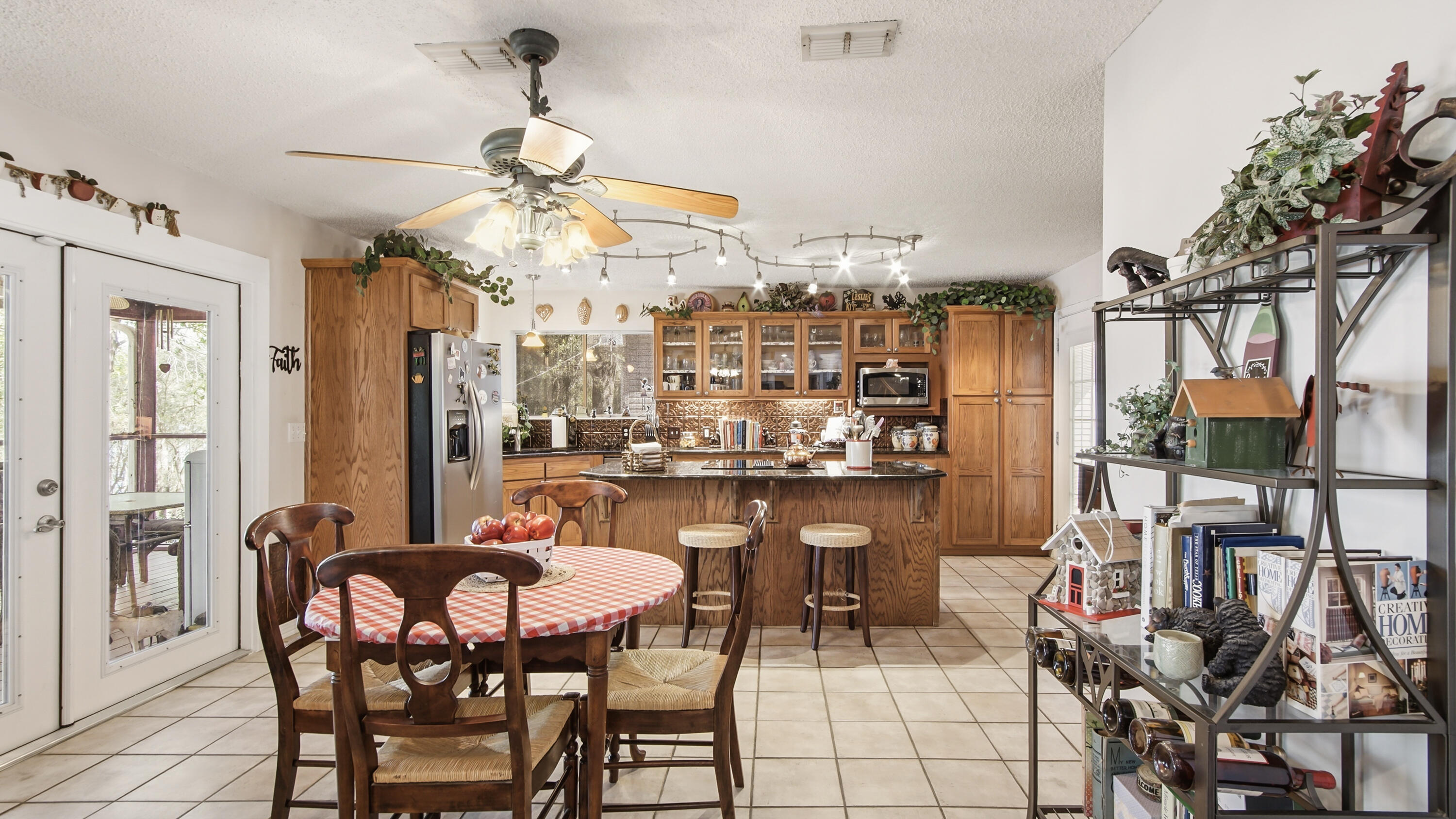 2272 Spring Lake Road DeFuniak Springs, FL 32433 - Photo 19 of 48 a dining room filled with furniture and a chandelier