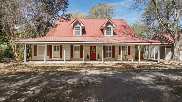 front view of a house with a garden