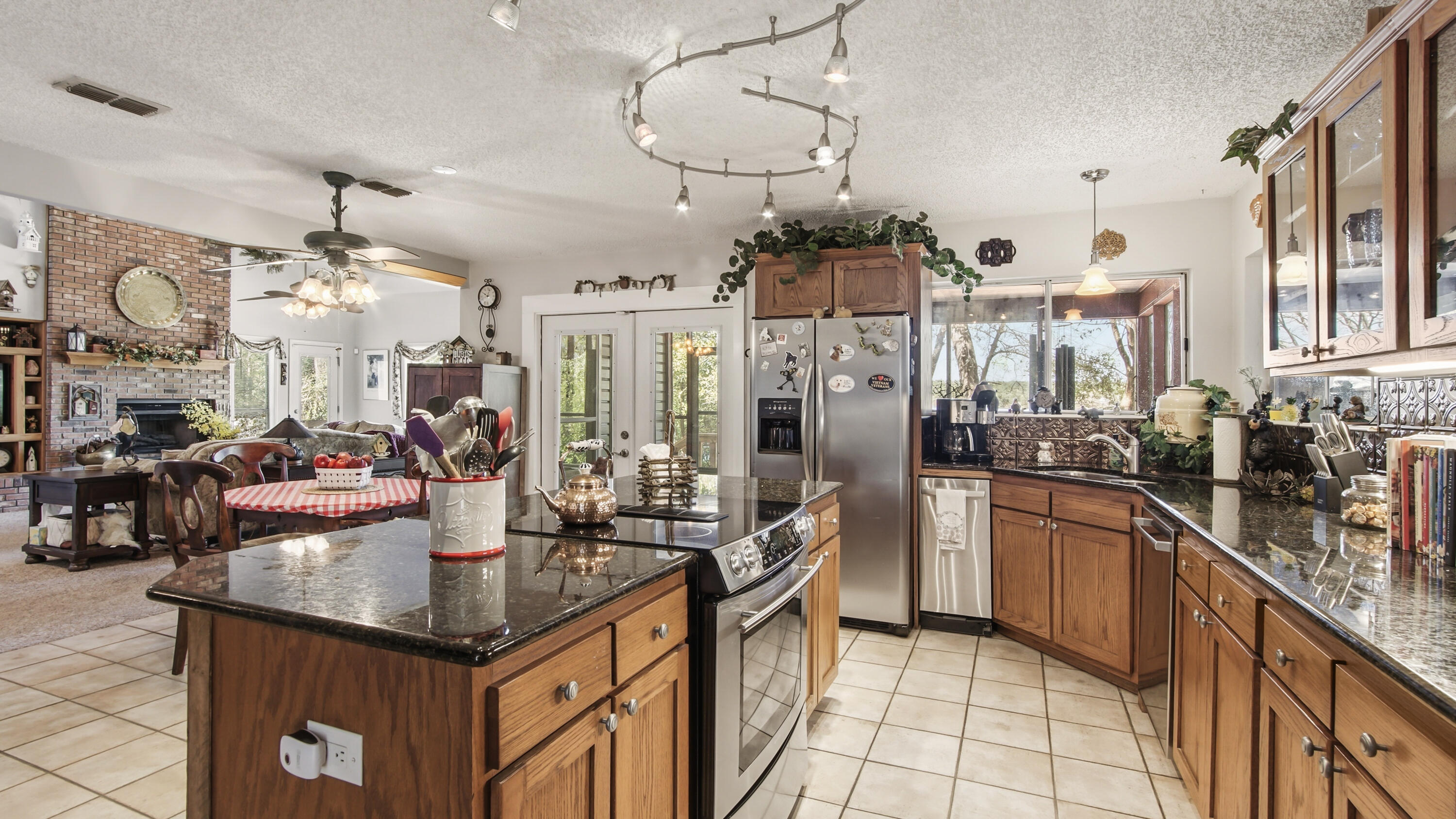 2272 Spring Lake Road DeFuniak Springs, FL 32433 - Photo 21 of 48 a kitchen with stainless steel appliances granite countertop a sink and cabinets