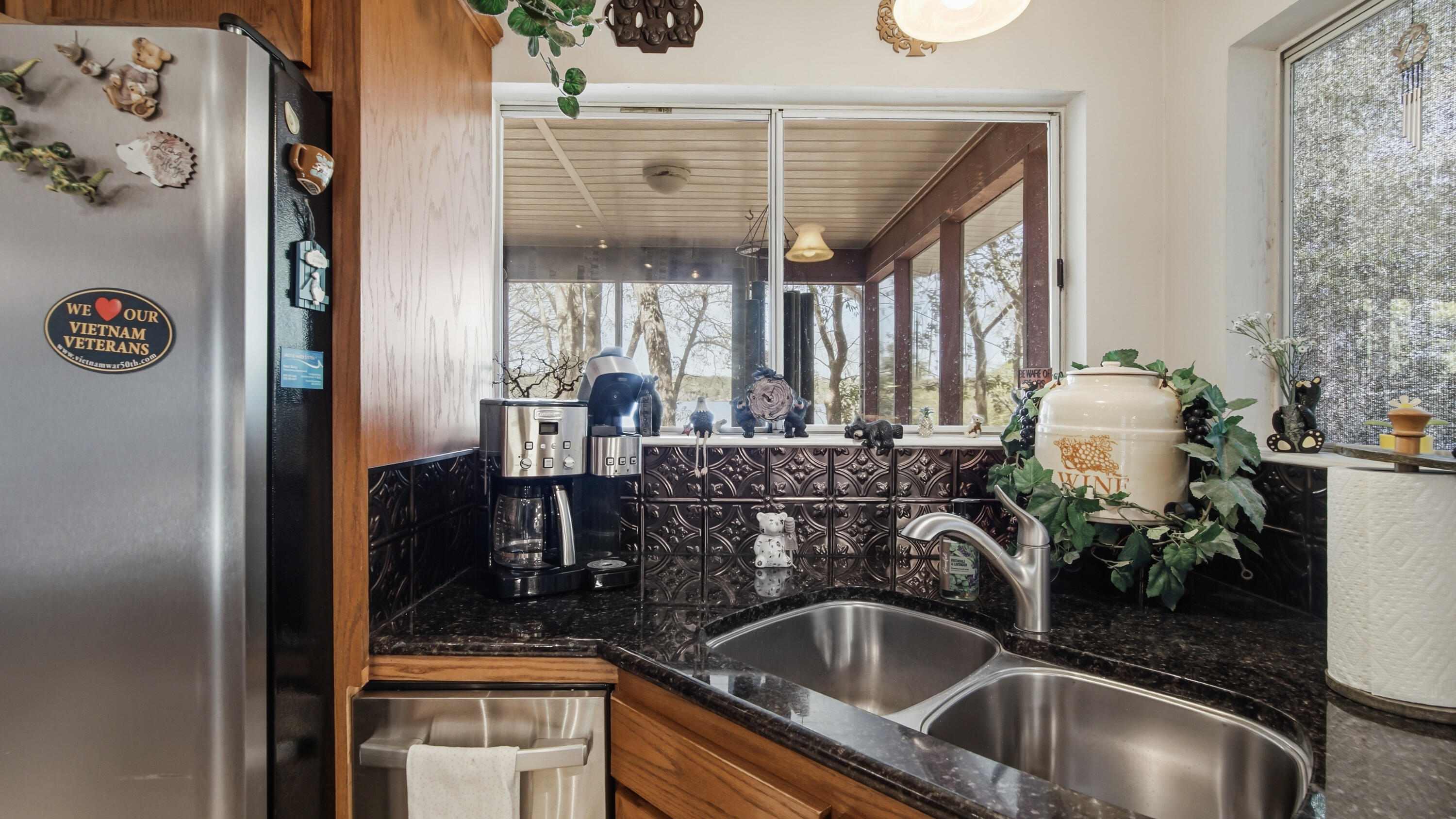 2272 Spring Lake Road DeFuniak Springs, FL 32433 - Photo 22 of 48 a kitchen with a sink and a refrigerator