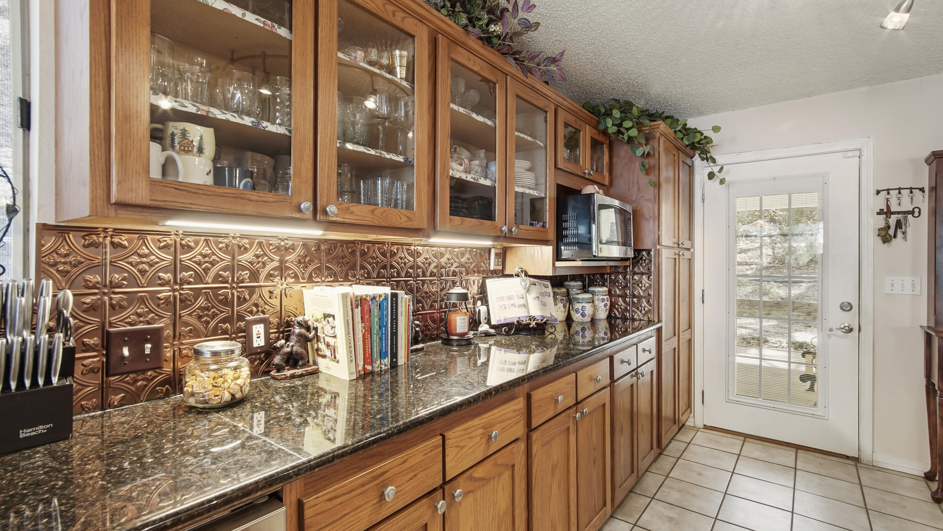 2272 Spring Lake Road DeFuniak Springs, FL 32433 - Photo 23 of 48 a kitchen with granite countertop a sink and a refrigerator