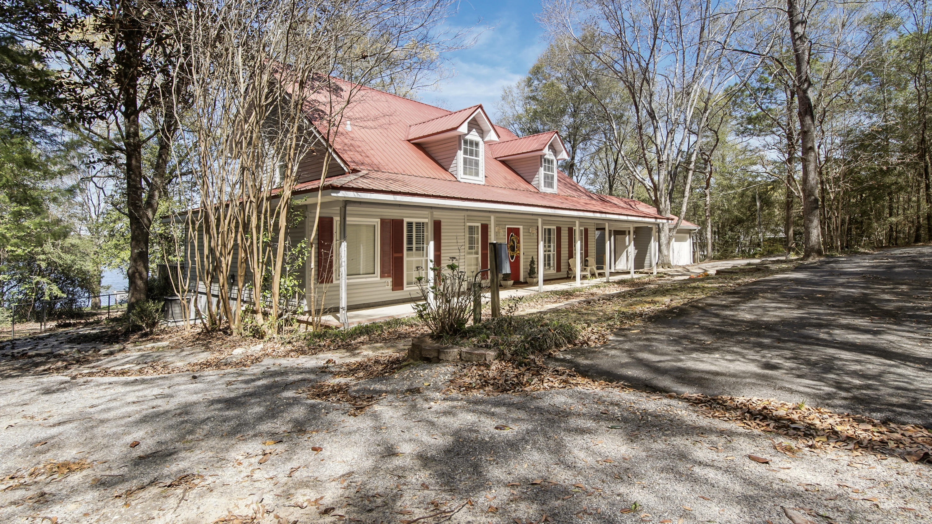 2272 Spring Lake Road DeFuniak Springs, FL 32433 - Photo 3 of 48 front view of a house with a yard