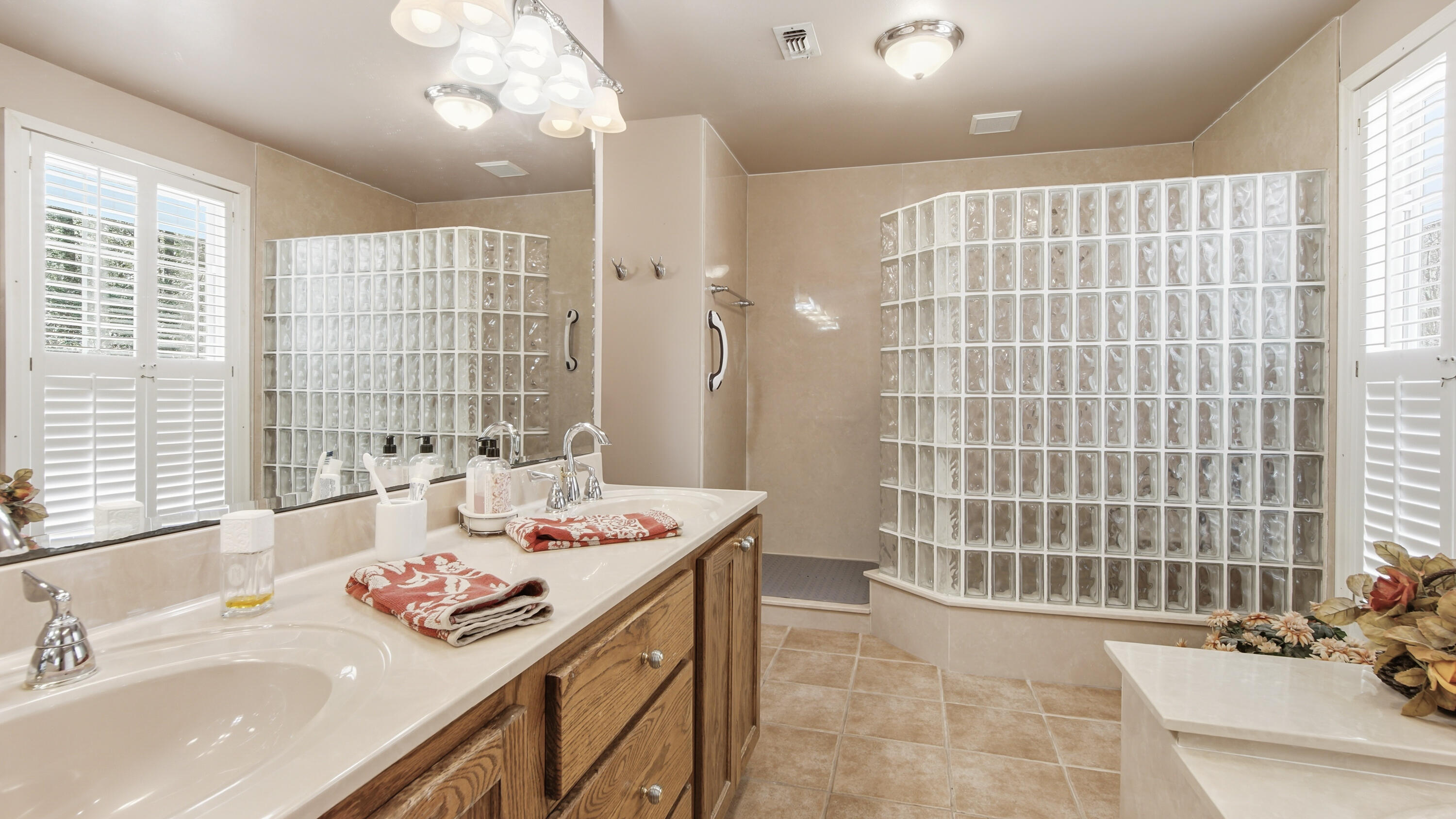 2272 Spring Lake Road DeFuniak Springs, FL 32433 - Photo 32 of 48 a bathroom with a sink double vanity and a shower