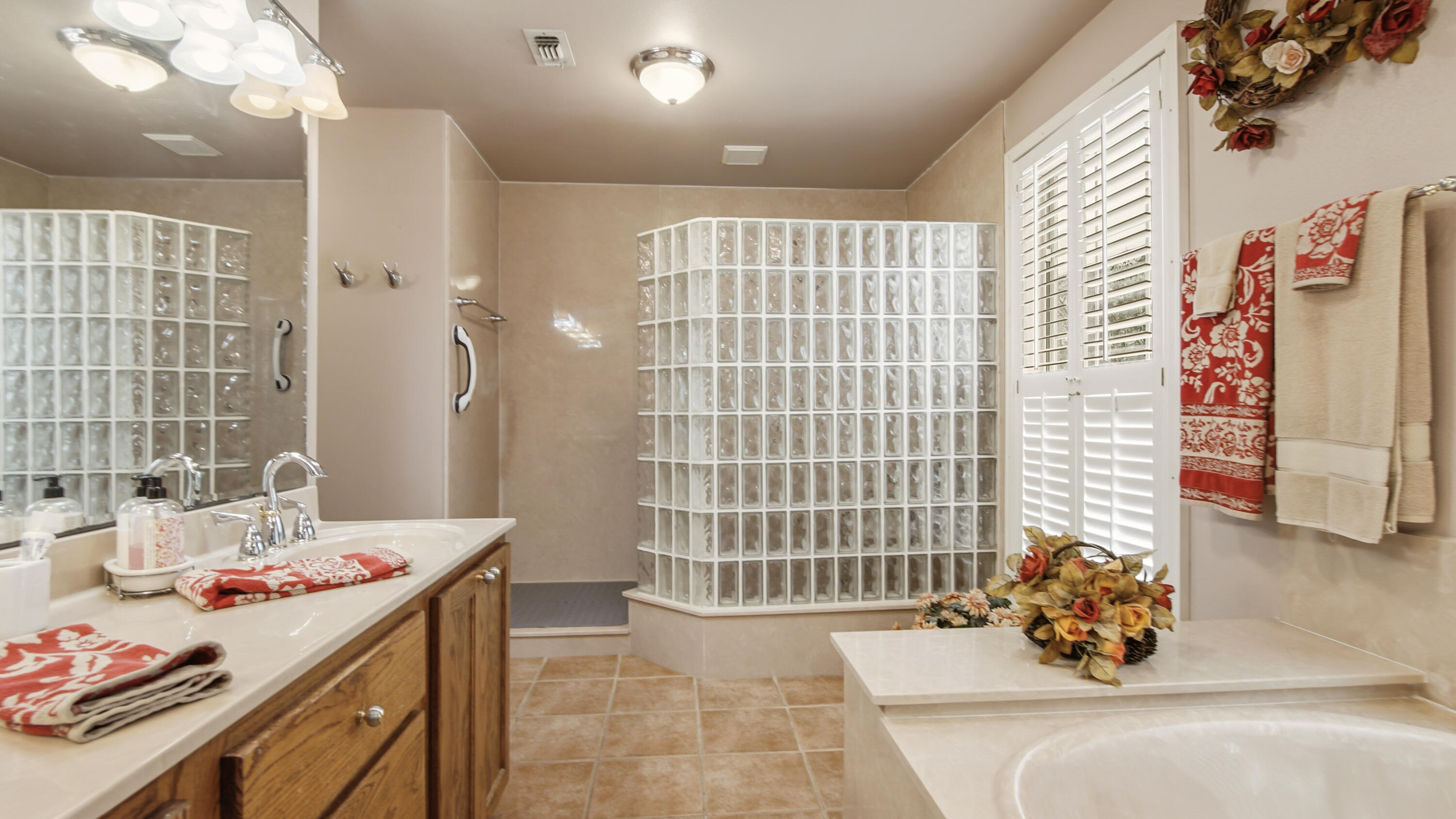 2272 Spring Lake Road DeFuniak Springs, FL 32433 - Photo 34 of 48 a bath room with a sink and a chandelier