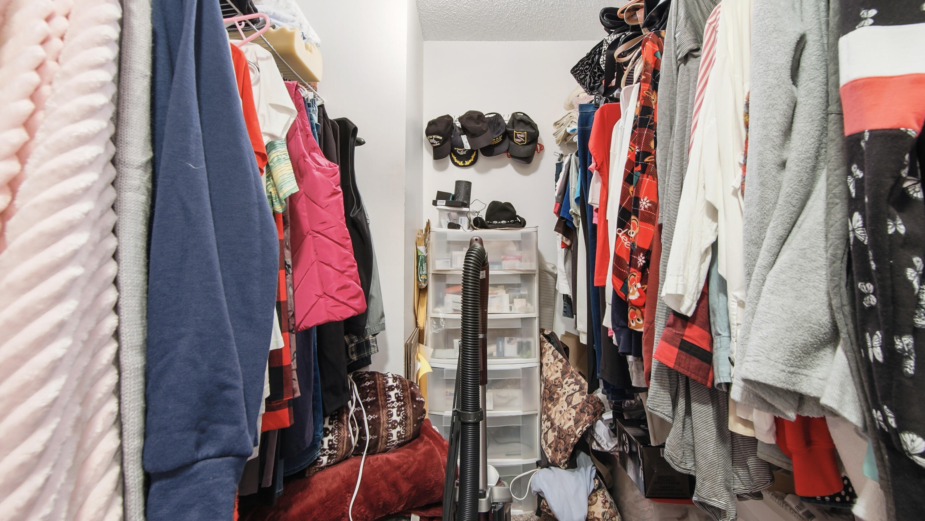 2272 Spring Lake Road DeFuniak Springs, FL 32433 - Photo 35 of 48 a view of walk in closet with clothes and shoes