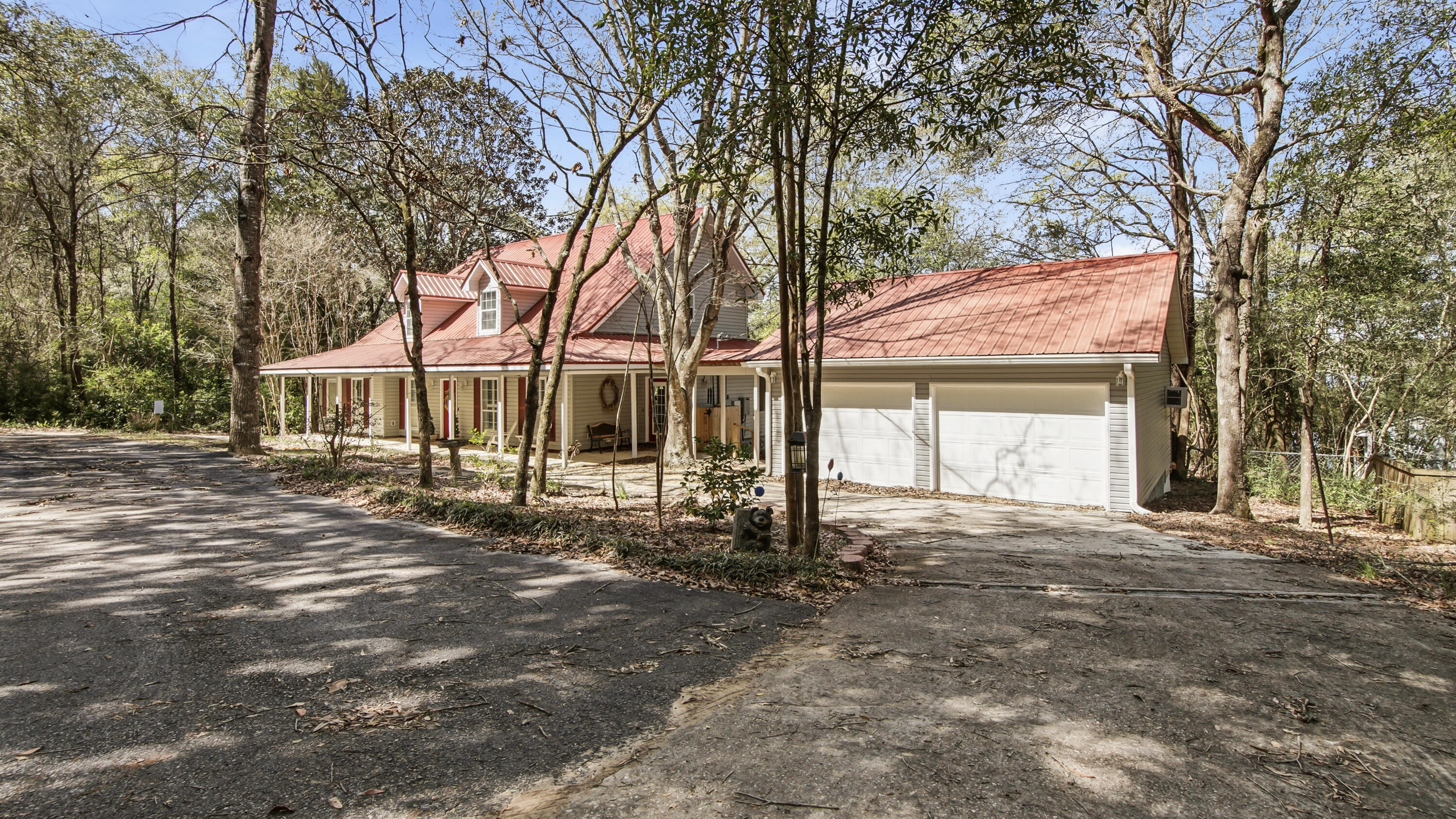 2272 Spring Lake Road DeFuniak Springs, FL 32433 - Photo 4 of 48 a view of a house with a yard and tree s
