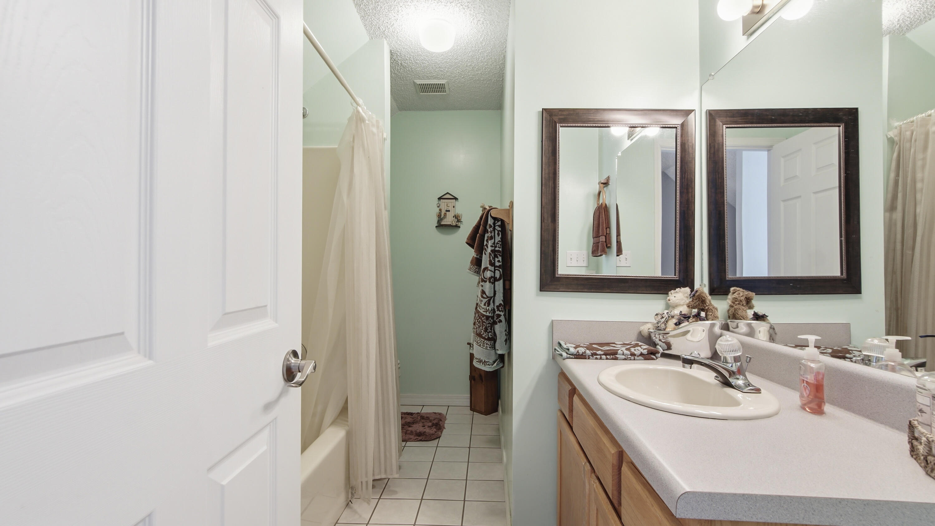 2272 Spring Lake Road DeFuniak Springs, FL 32433 - Photo 41 of 48 a bathroom with a sink and a mirror