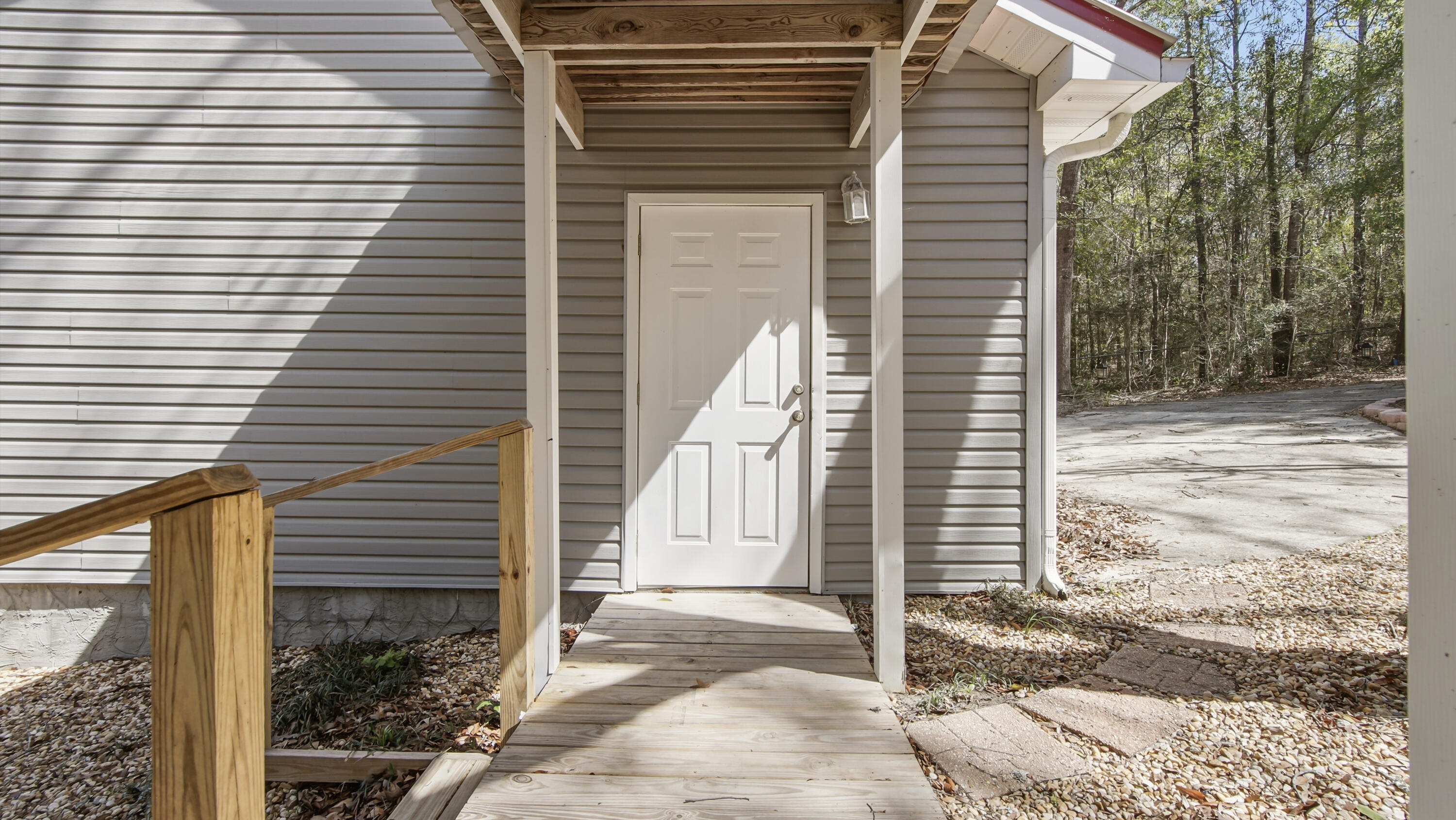 2272 Spring Lake Road DeFuniak Springs, FL 32433 - Photo 47 of 48 a view of a house with a yard and garage