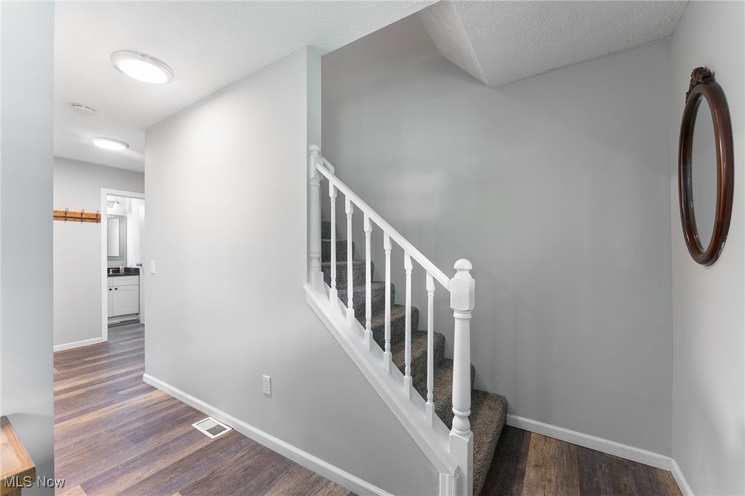 1761 Rustic Run Road Warren, OH 44481 - Photo 25 of 45 Stairs with wood finished floors and baseboards
