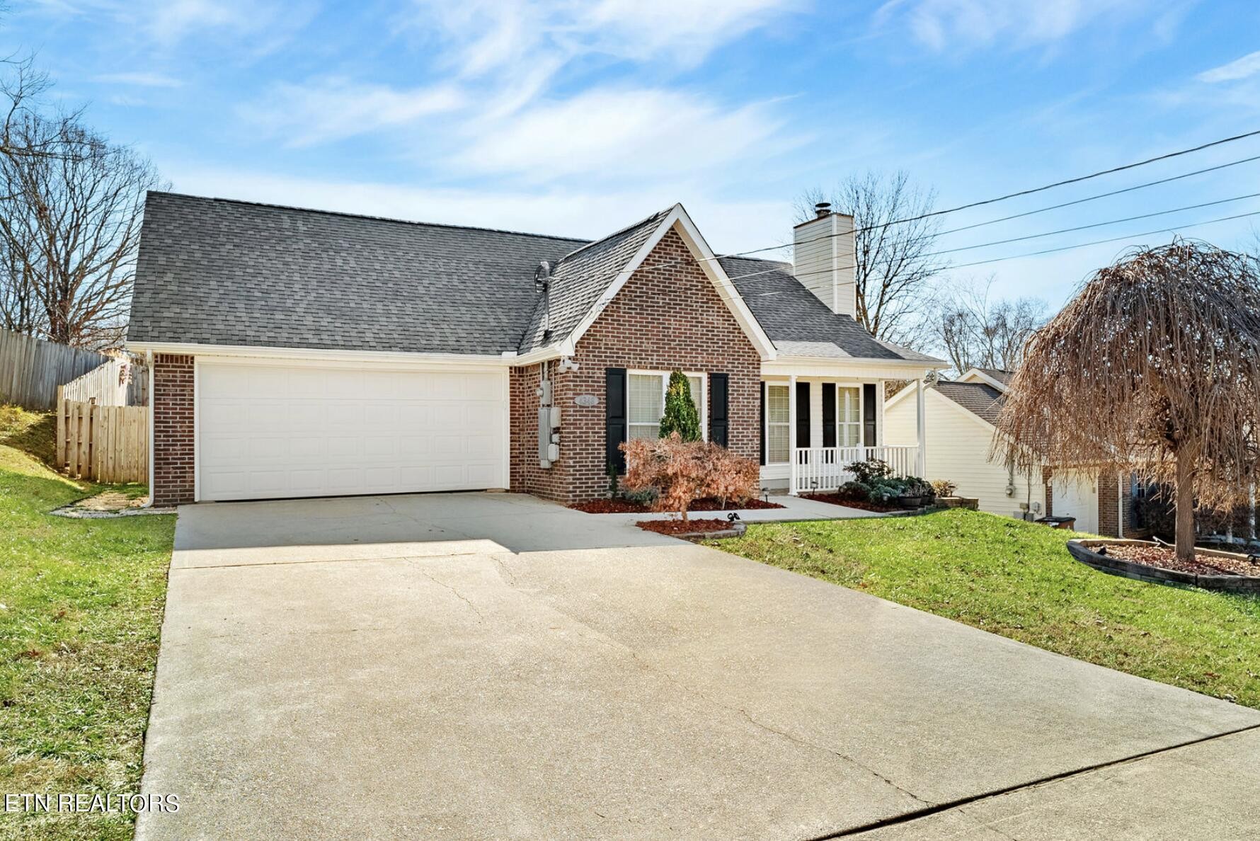 4348 Walnut Ridge Lane Knoxville, TN 37921 - Photo 1 of 31 a front view of a house with a yard and garage