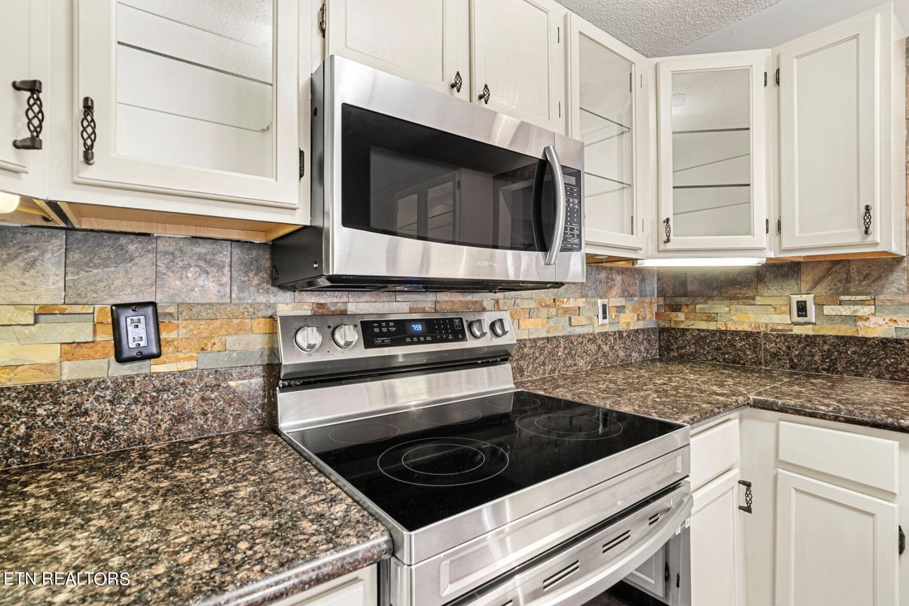 4348 Walnut Ridge Lane Knoxville, TN 37921 - Photo 12 of 31 a kitchen with a stove and a microwave