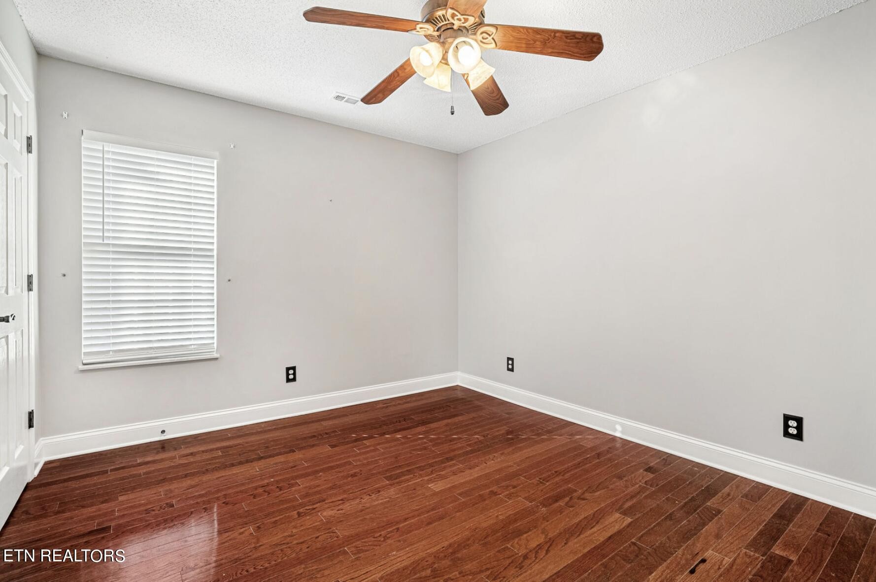 4348 Walnut Ridge Lane Knoxville, TN 37921 - Photo 16 of 31 wooden floor in an empty room with a window