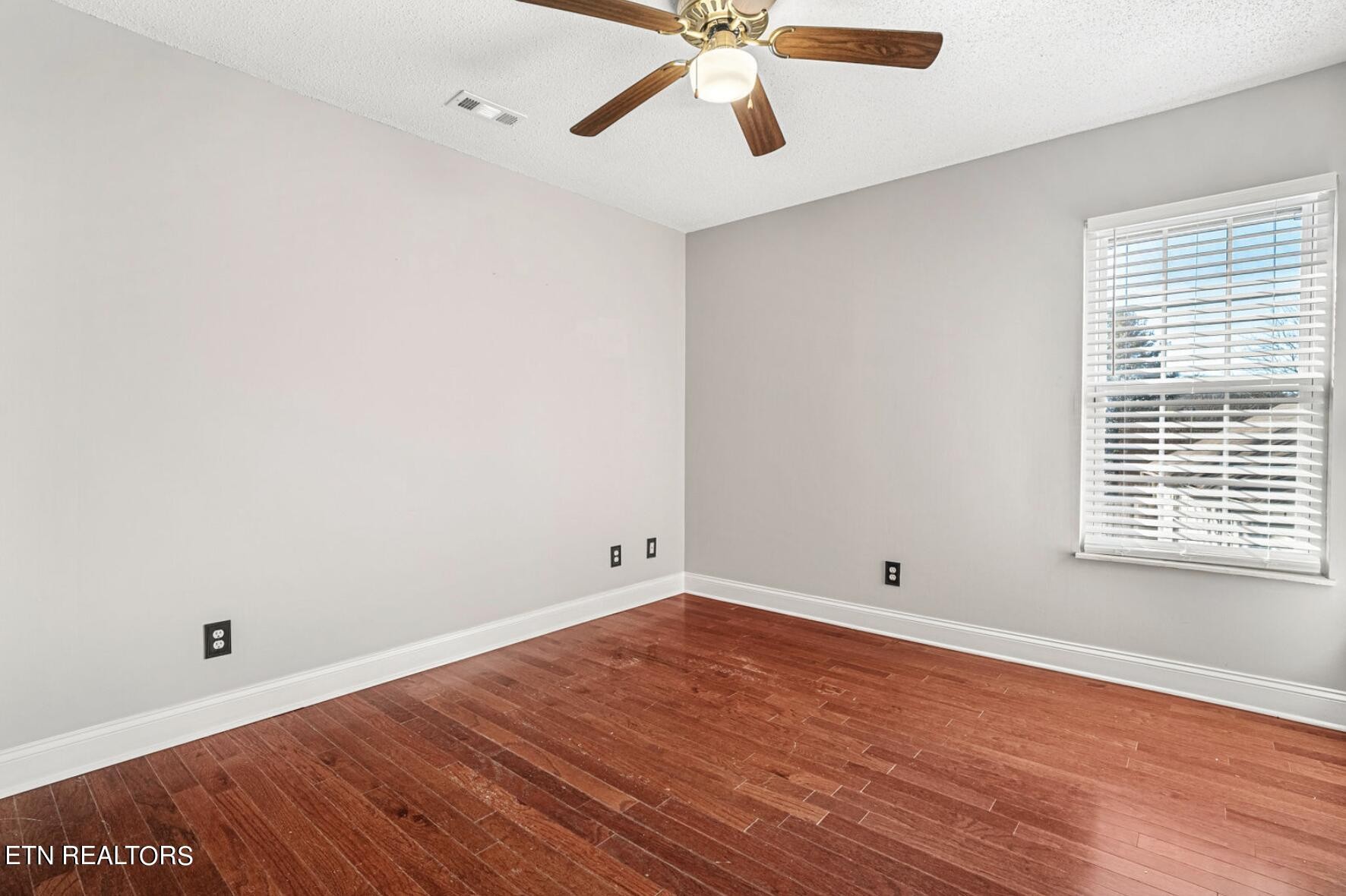 4348 Walnut Ridge Lane Knoxville, TN 37921 - Photo 18 of 31 an empty room with a window and ceiling fan