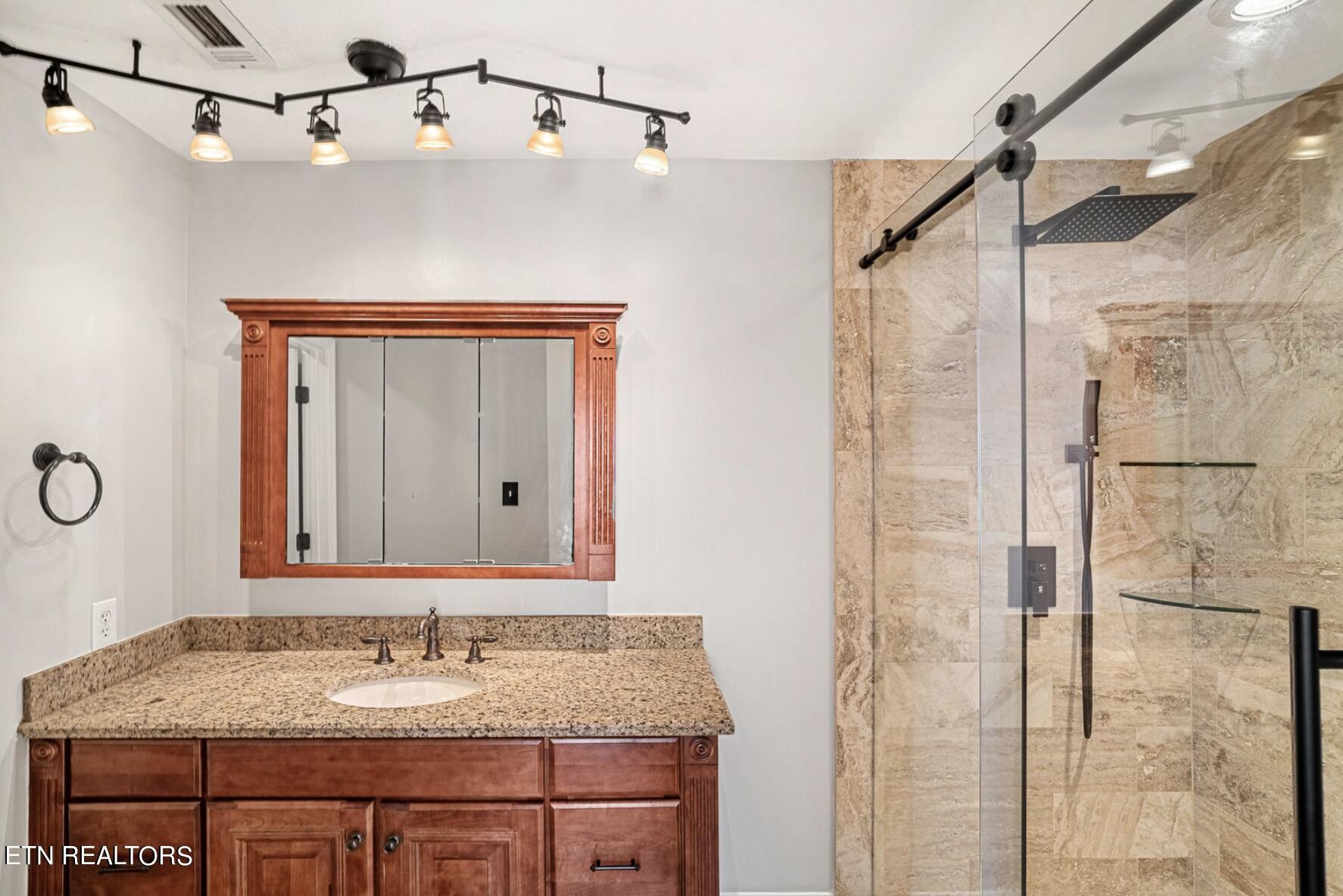 4348 Walnut Ridge Lane Knoxville, TN 37921 - Photo 23 of 31 a bathroom with a granite countertop sink mirror and shower