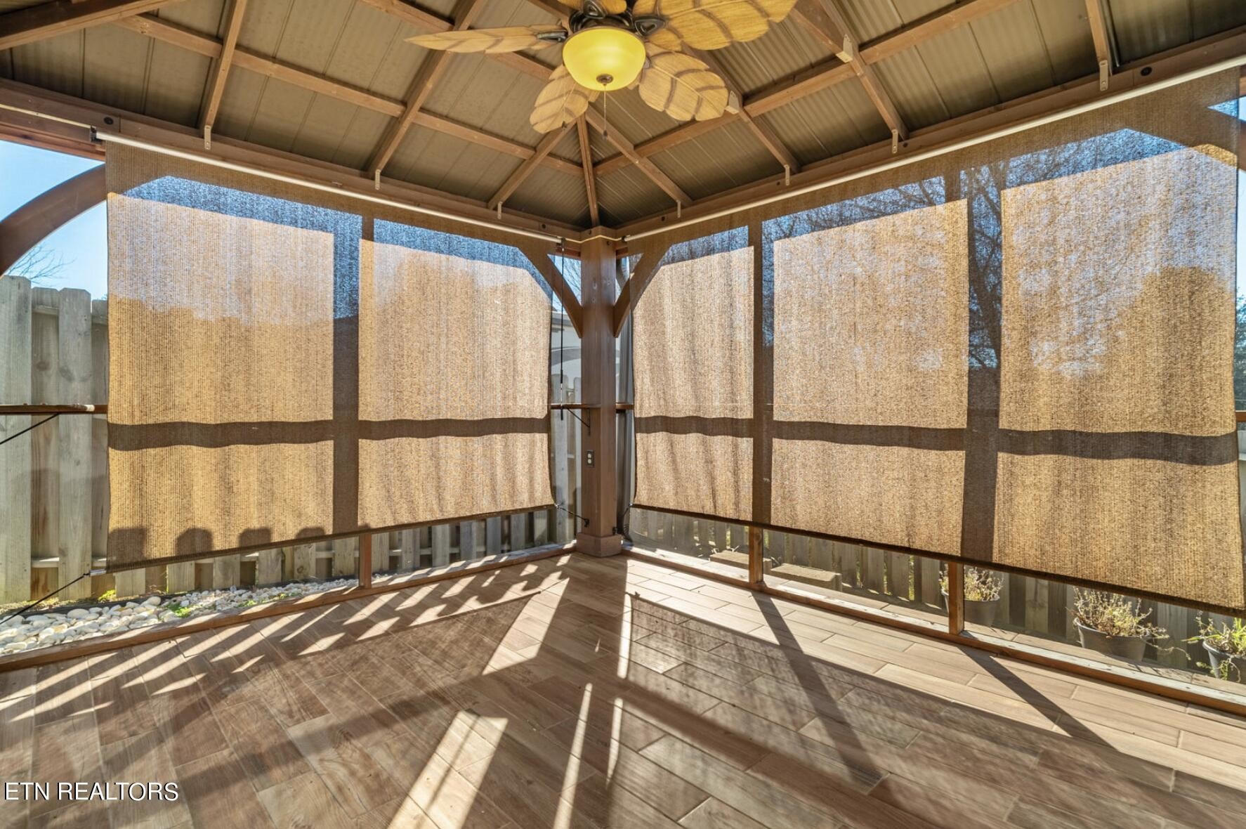 4348 Walnut Ridge Lane Knoxville, TN 37921 - Photo 29 of 31 a view of an empty room with wooden floor and windows