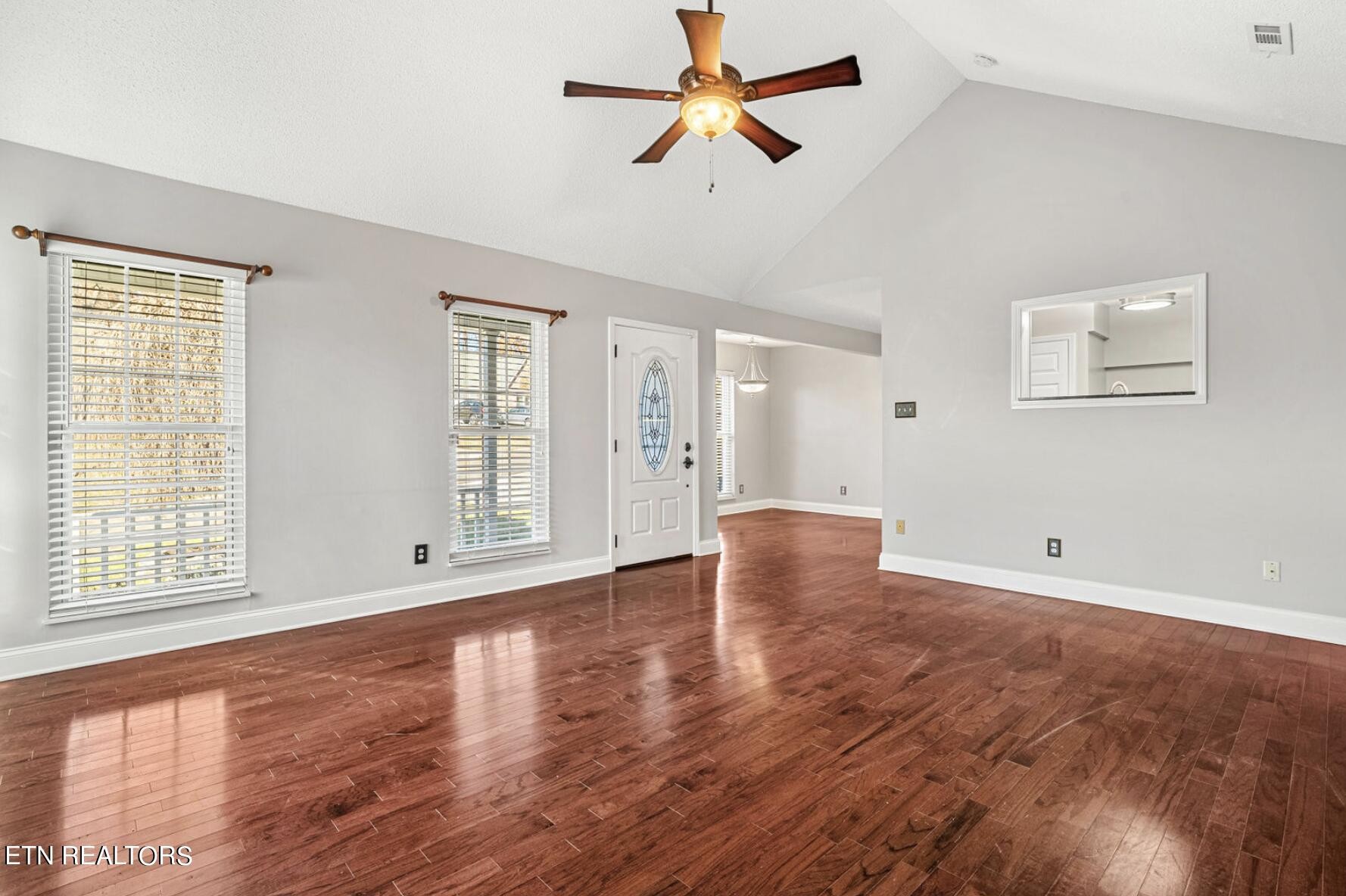 4348 Walnut Ridge Lane Knoxville, TN 37921 - Photo 5 of 31 a view of an empty room with window and wooden floor