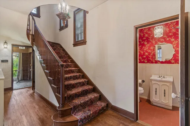 a view of entryway and hall with wooden floor