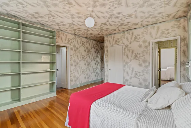 a bedroom with a bed and a closet