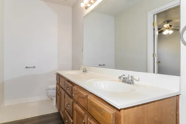a bathroom with a sink vanity tub and shower