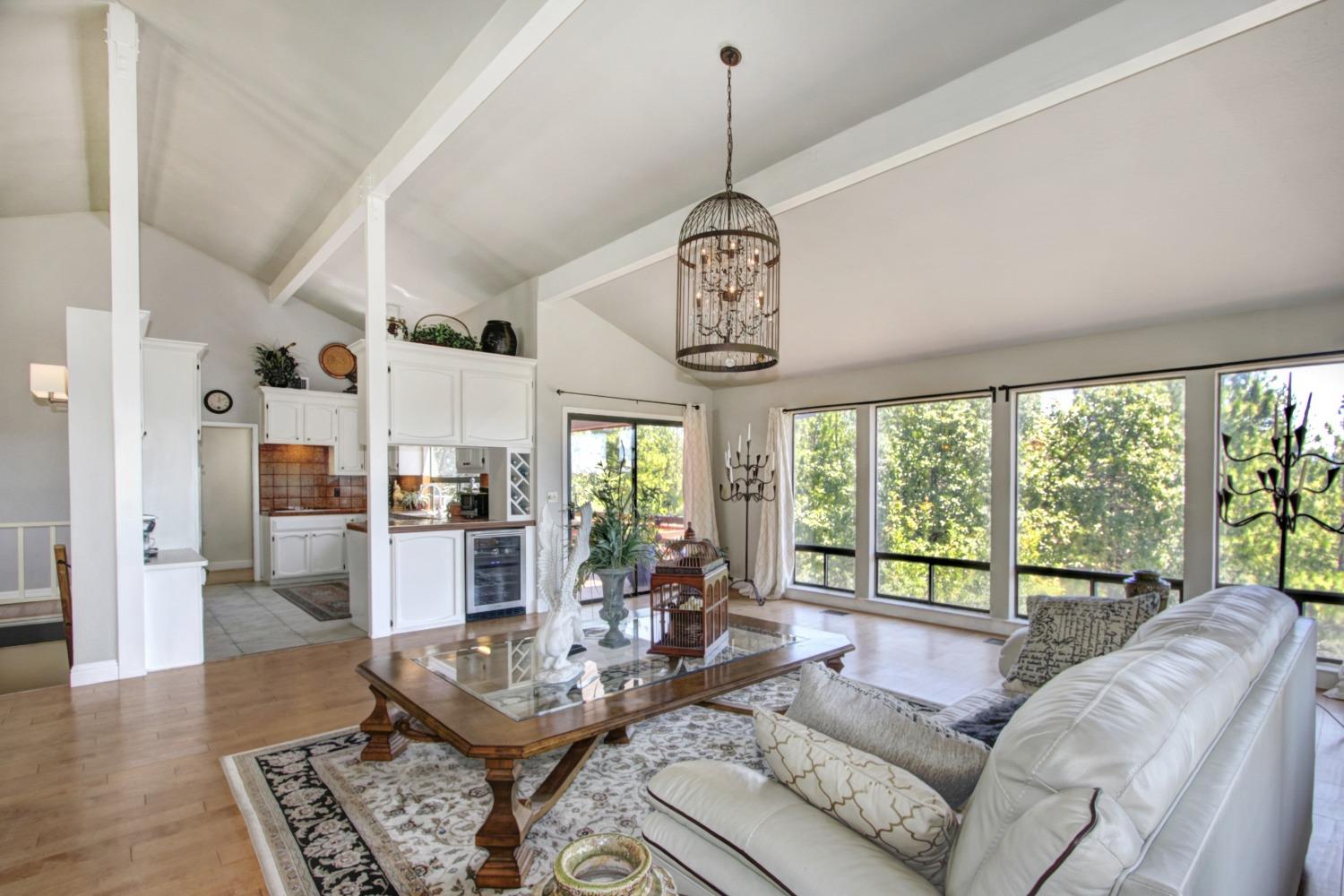 18119 Norlene Way Grass Valley, CA 95949 - Photo 19 of 93 a living room with furniture and a floor to ceiling windows