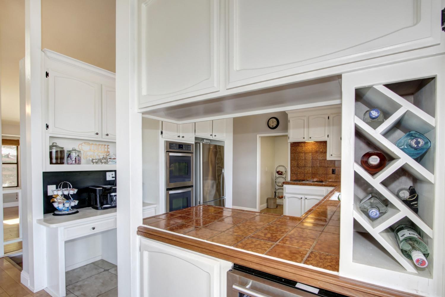 18119 Norlene Way Grass Valley, CA 95949 - Photo 22 of 93 a kitchen with stainless steel appliances granite countertop a refrigerator and a stove top oven