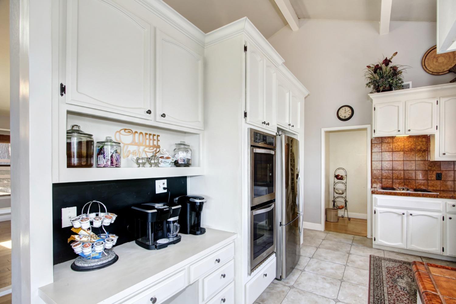 18119 Norlene Way Grass Valley, CA 95949 - Photo 23 of 93 a kitchen with stainless steel appliances granite countertop a refrigerator and cabinets