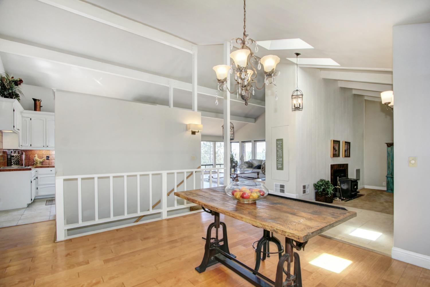 18119 Norlene Way Grass Valley, CA 95949 - Photo 34 of 93 a view of a dining room with furniture and wooden floor