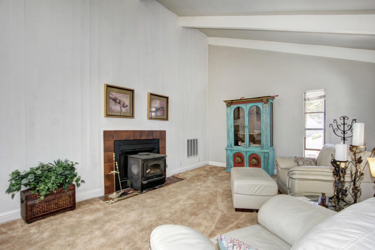 18119 Norlene Way Grass Valley, CA 95949 - Photo 35 of 93 a living room with furniture and a fireplace