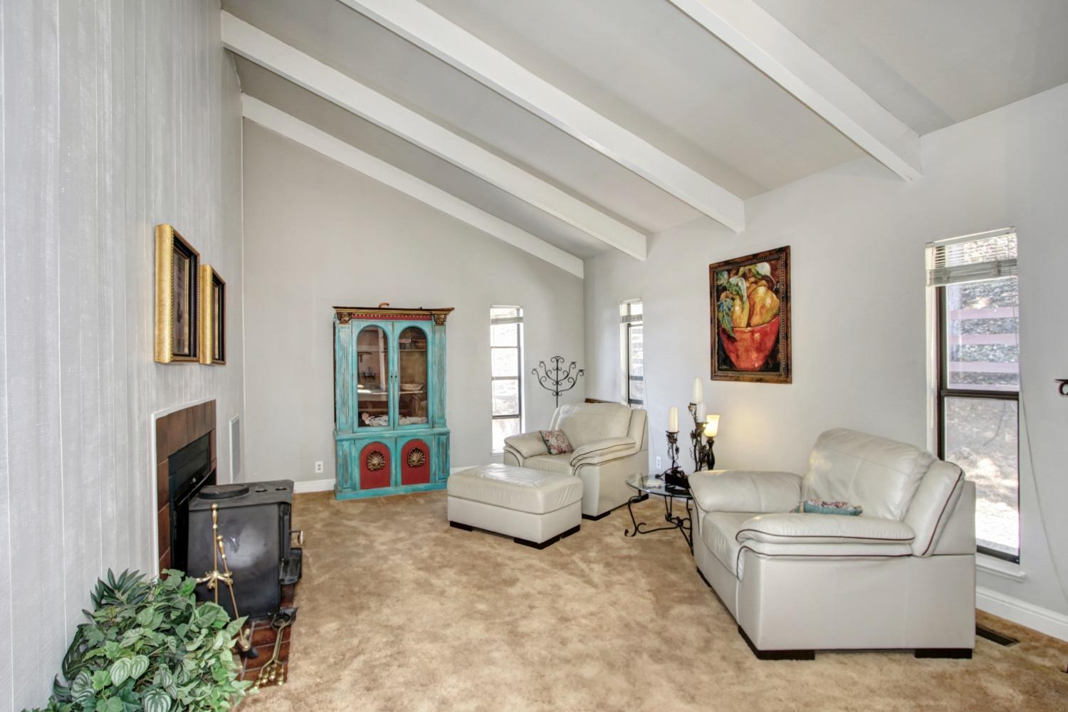 18119 Norlene Way Grass Valley, CA 95949 - Photo 37 of 93 a living room with furniture and a flat screen tv