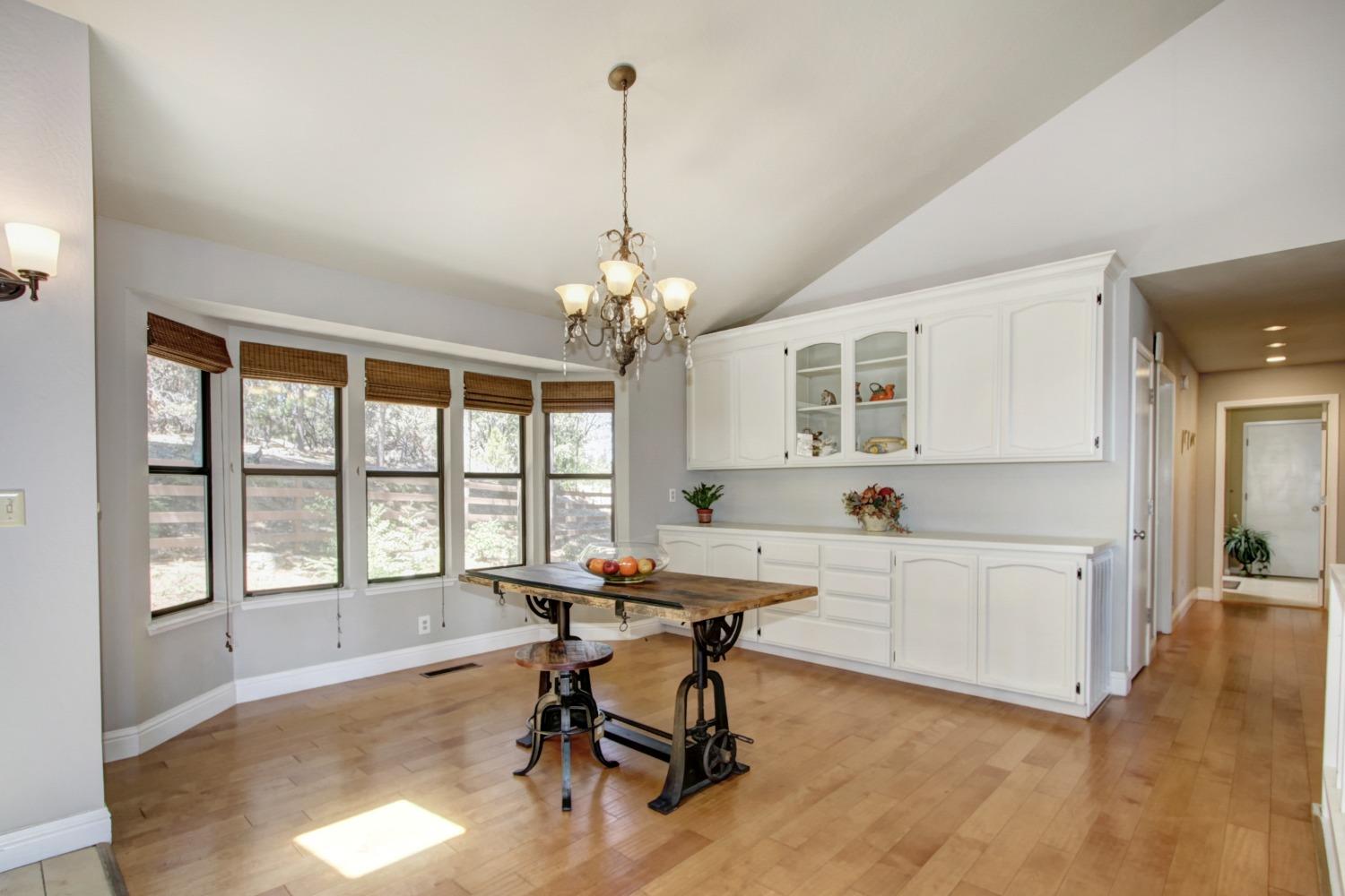 18119 Norlene Way Grass Valley, CA 95949 - Photo 43 of 93 a view of a workspace with furniture and a window