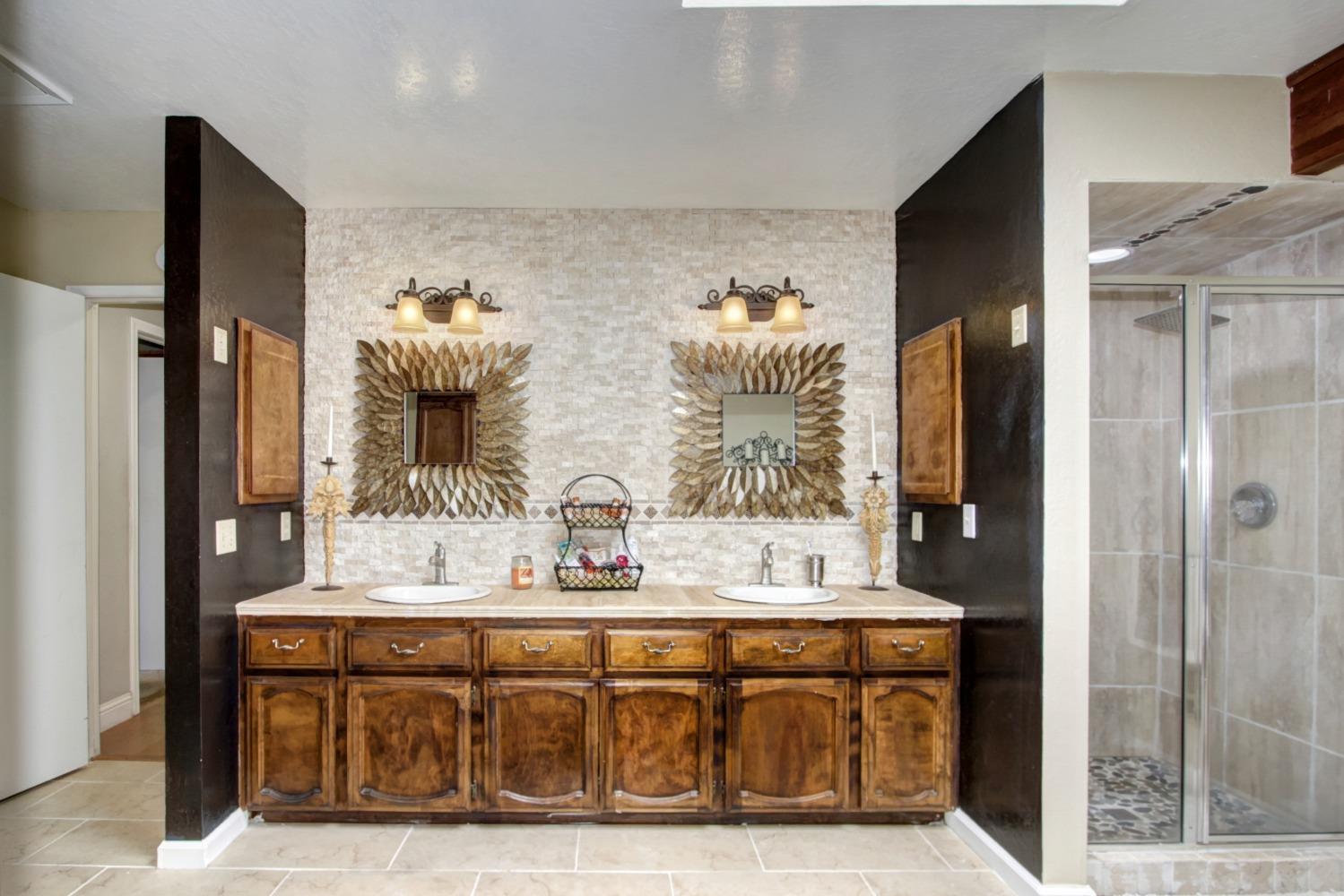 18119 Norlene Way Grass Valley, CA 95949 - Photo 49 of 93 a bathroom with double vanity and a mirror