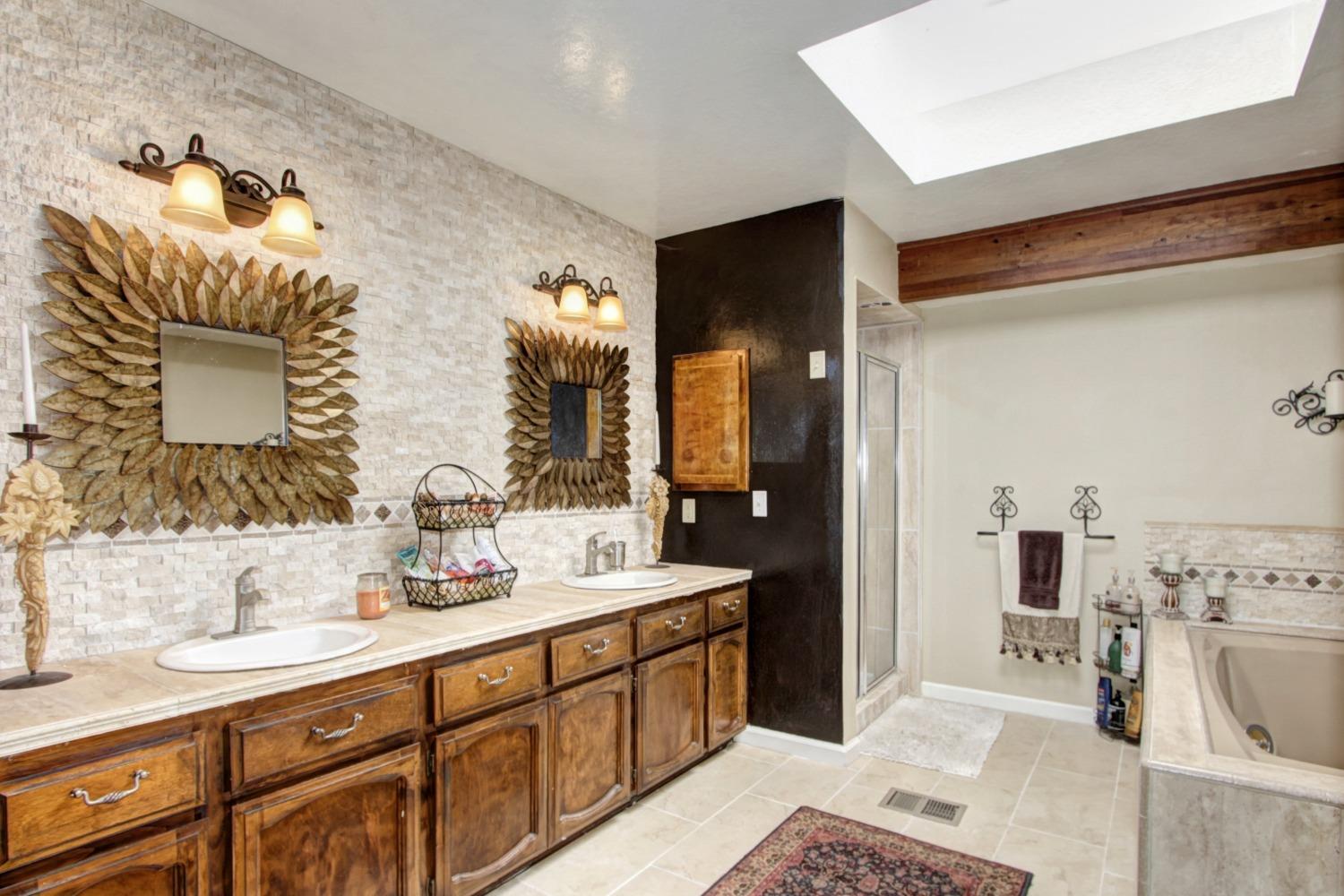 18119 Norlene Way Grass Valley, CA 95949 - Photo 51 of 93 a spacious bathroom with a double vanity sink mirror and