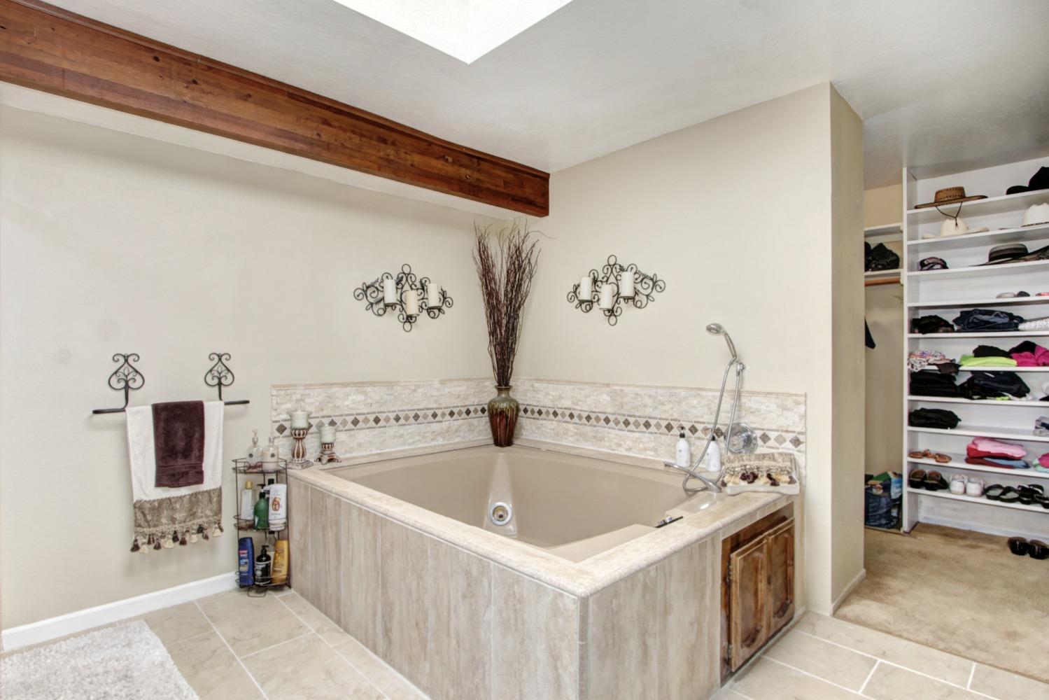 18119 Norlene Way Grass Valley, CA 95949 - Photo 53 of 93 a bathroom with a bathtub and a sink