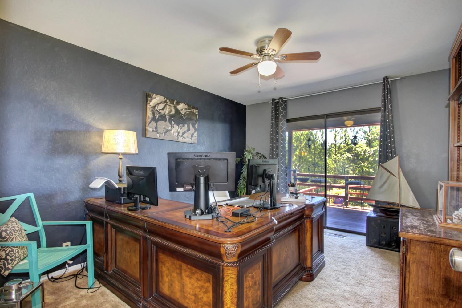 18119 Norlene Way Grass Valley, CA 95949 - Photo 54 of 93 a living room with fireplace furniture and a large window