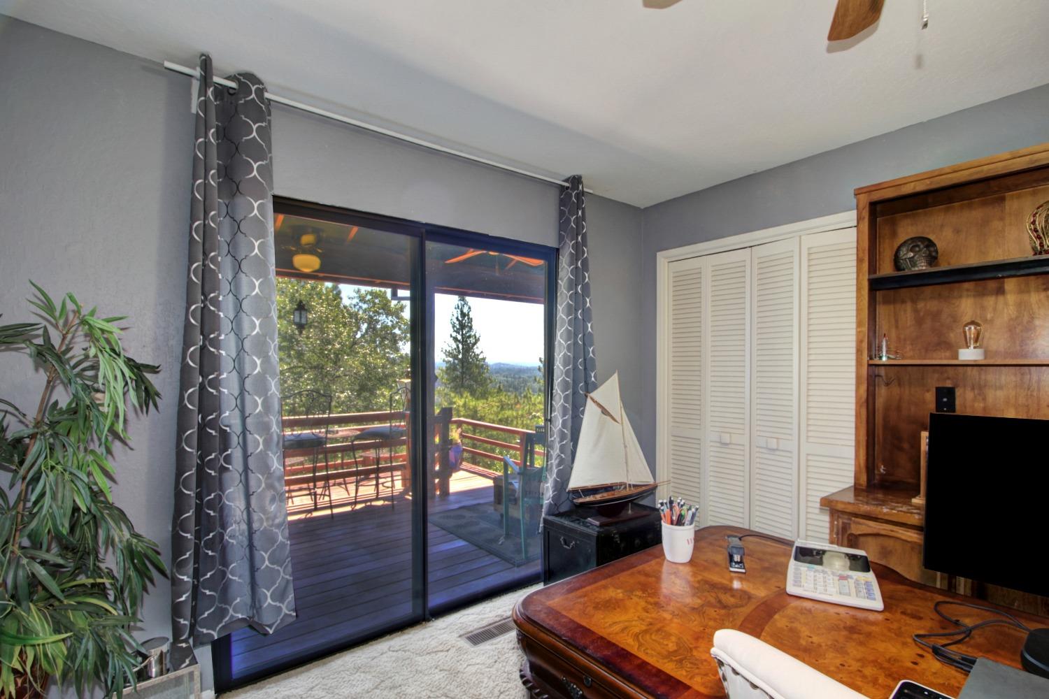 18119 Norlene Way Grass Valley, CA 95949 - Photo 55 of 93 a living room with furniture and a flat screen tv